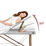 Professional foldable massage bed with wooden legs and white leather surface